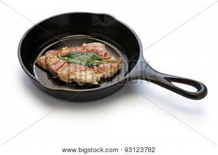 saltimbocca alla romana ( cooked veal, prosciutto and sage ) on skillet
