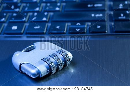 Number lock padlock on a laptop to illustrate data security
