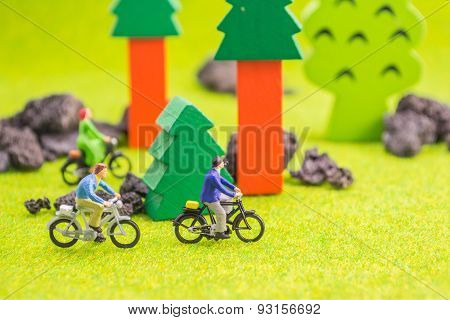 Image Group Of People(mini Figure) With Retro Bicycle In A Park - Outdoor Portrait