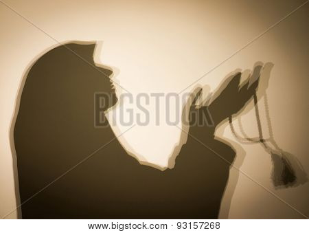 Muslim woman praying abstract silhouette