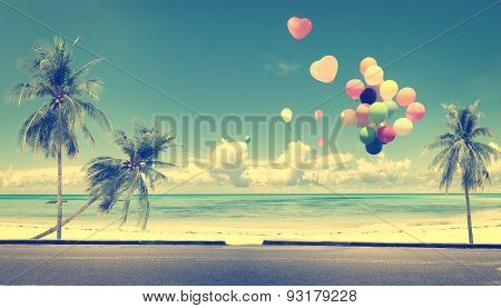 Vintage with heart balloon on beach blue sky concept of love in summer and wedding honeymoon