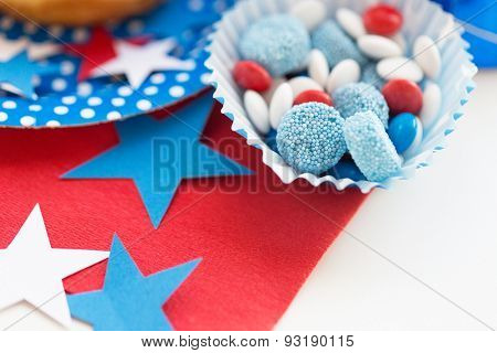 american independence day, celebration, patriotism and holidays concept - close up of glazed sweet candies with stars decoration at 4th july theme party