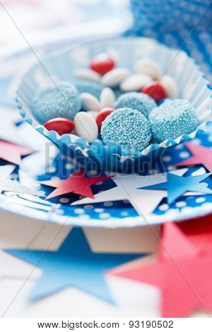 american independence day, celebration, patriotism and holidays concept - close up of glazed sweet candies with stars decoration at 4th july theme party
