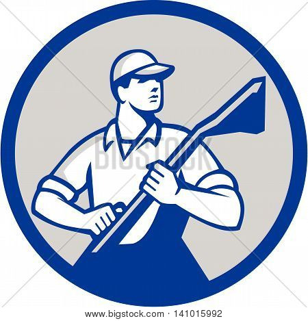 Illustration of a professional male carpet cleaner worker holding vacuum cleaner looking to the side viewed from front set inside circle on isolated background done in retro style.