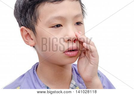 Young Asian boy with bleeding from nose over white