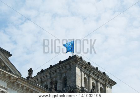 Close-up of German flag on famous Reichstag building seat of the German Parliament (Deutscher Bundestag) travel in Berlin