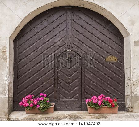 Old brown door in Borgo Villa il Poggio Piedmont Italy.