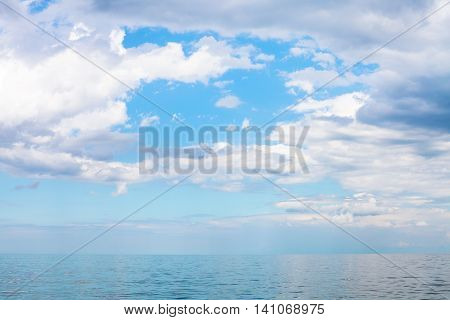 Scenery Of Blue Sky With White Clouds Over Calm Sea
