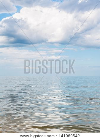 Big White Cloud Over Calm Water Of Azov Sea