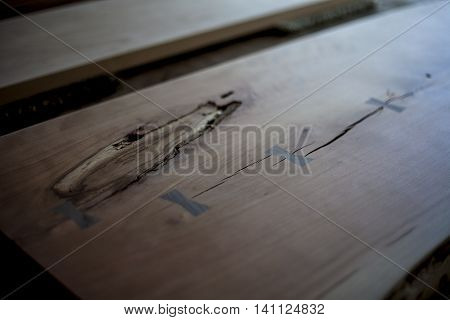 Custom wood table top awaiting stain and assembly.