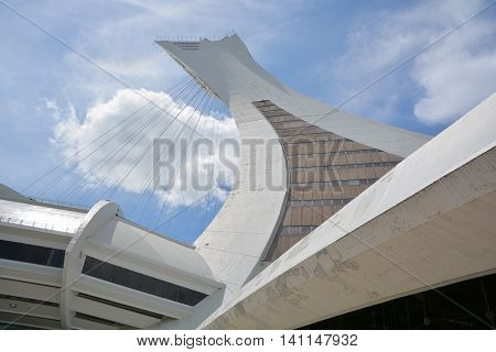 MONTREAL CANADA JULY 30 2016. Men repair the Montreal Olympic Stadium tower. It's the tallest inclined tower in the world.Tour Olympique stands 175 meters tall and at a 45-degree angle