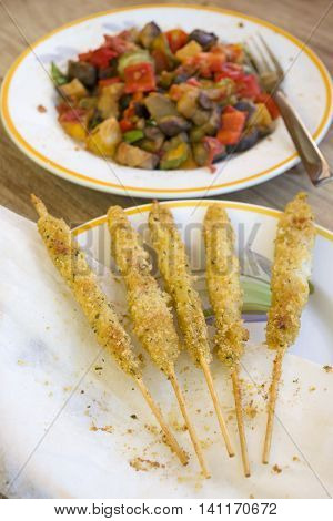 fish skewers made with mollusks cut in chunks and pierced by a skewer