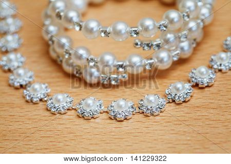 Wedding bijouterie of a bride on table. Closeup