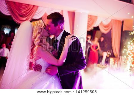 Amazing First Wedding Dance Of Newlyweds On Low Pink Light And Heavy Smoke With Fireworks