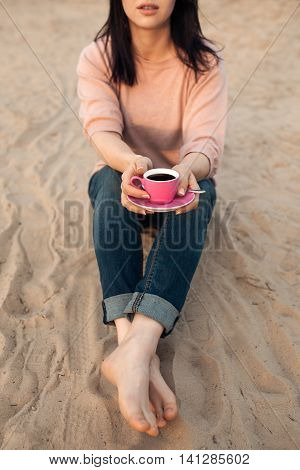 Barefoot Female On The Beach And With Cup Of Coffee;