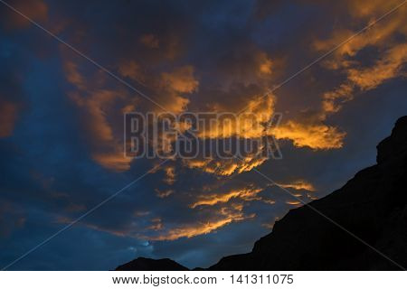 Beautiful clouds illuminated by the setting sun in sky