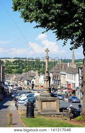 BURFORD, UNITED KINGDOM - JULY 20, 2016 - View of shops and businesses along The Hill shopping street with the war memorial in the foreground Burford Oxfordshire England UK Western Europe, July 20, 2016.