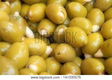Green olives with almonds, marinated with basil