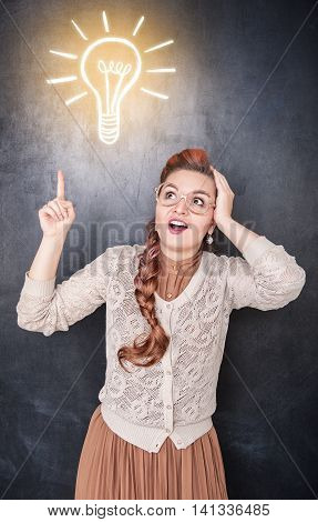 Woman Showing On Drawing Lamp By Finger