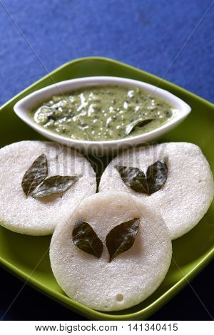 Idli With Coconut Chutney On Blue Background, Indian Dish : South Indian Favourite Food Rava Idli Or