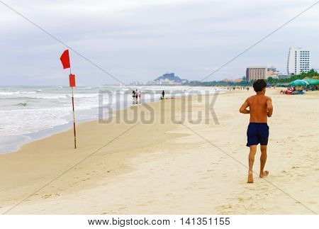 Man Running Along China Beach In Danang In Vietnam