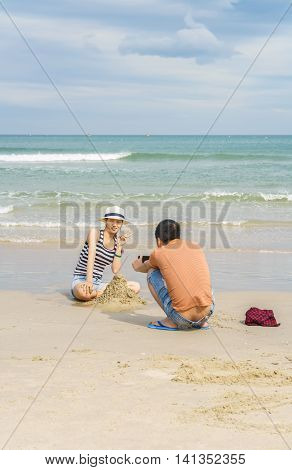 Young People Taking Photos In China Beach In Danang
