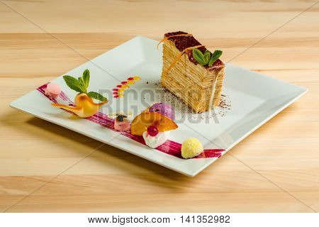 Dessert - Cake with chocoltae Icing and Fresh Mint. Sweet food calorie