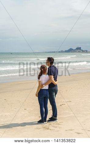 Young Couple Looking At Sea In China Beach Of Danang