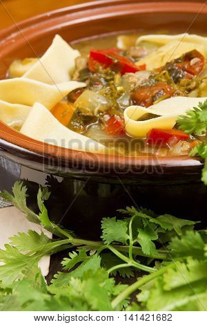 Oriental Lagman Uzbek soup on a wooden table