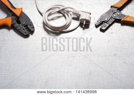 Set of electrical tool on wooden background. Accessories for engineering work, energy concept