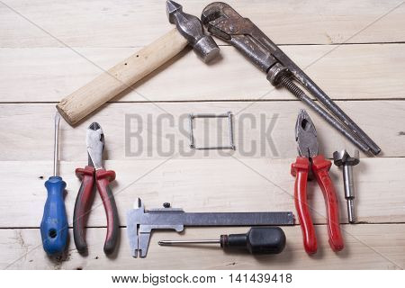 Set of electrical tool on wooden background. Accessories for engineering work, energy concept