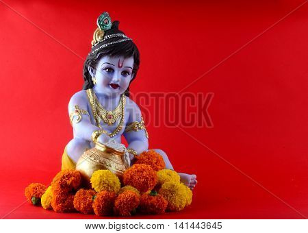 Hindu God Krishna on red background. Greeting Design