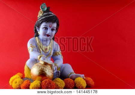 Hindu God Krishna on red background. Greeting Design