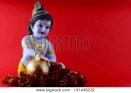 Hindu God Krishna on red background. Greeting Design