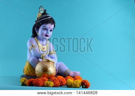 Hindu God Krishna on blue background. Greeting card Design. Space for Headline and Copy.