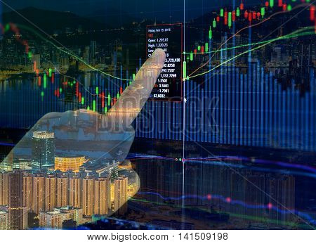 Double exposure of stocks market chart in blue on LED display concept with city scape hong kong background