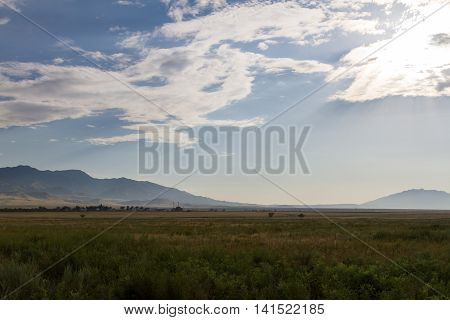 Steppe, Mountains And Clouds