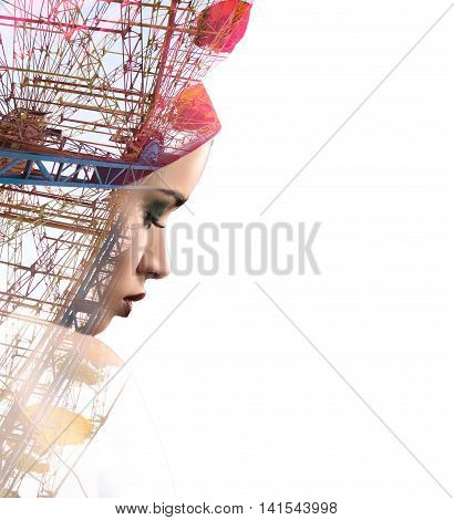 Sad woman combined with big panoramic wheel on white. Double exposure shot of beautiful latin female with red scarf on head.
