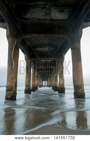 Under the Manhattan Beach Pier at dawn