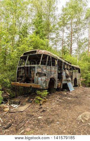 KIRKOE MOSSE SWEDEN - 28 JULY 2016: A car graveyard situated in a forest at Kirkoe Mosse Sweden.
