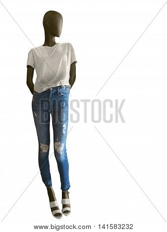 Full-length female mannequin dressed in t-shirt and blue jeans isolated on white background. No brand names or copyright objects.