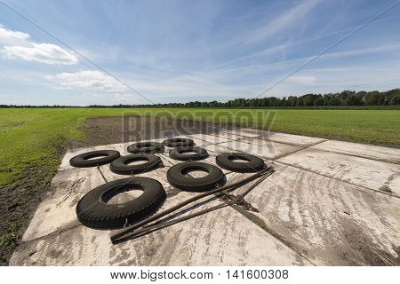 Switched tires as a machine at the back of the tractor to level out bumpy agricultural field