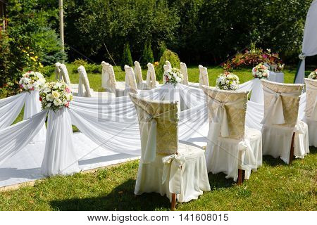 Wedding ceremony decorations in the park at sunny day