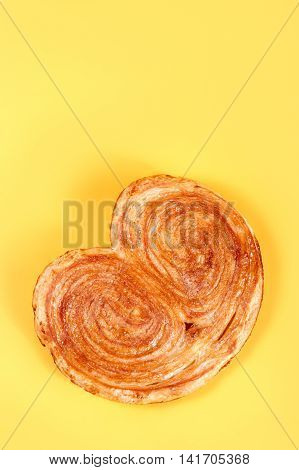 Sweet Puff Pastry On Yellow Background - Palmeras