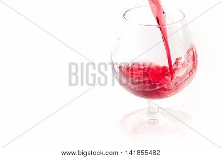 abstract patterns pours a drink into a glass of wine