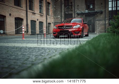 Moscow, Russia - July 10, 2016: Red Car Mercedes-benz C63 Amg Stay On Asphalt Road In The City Mosco