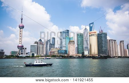SHANGHAI-JUNE 2, 2012. Huangpu River and Pudong district seen from Bund. The Pudong district houses Lujiazui Finance and Trade Zone and the Shanghai Stock Exchange, it is China's financial center.