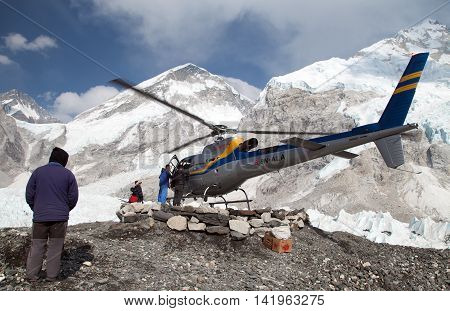 EVEREST BASE CAMP NEPAL 27th APRIL 2016 - helicopter in Mount Everest base camp and mount Nuptse Nepal