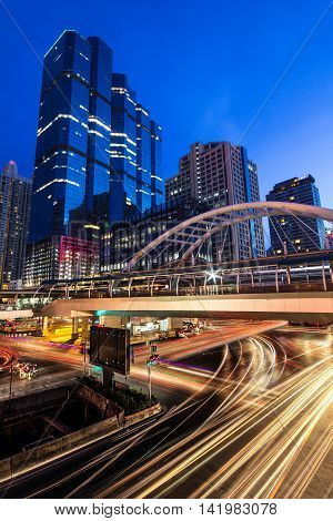 BANGKOK - MAY 31 : Buildings and a sky walk architecture like spider for transit between Sky Transit and Bus Rapid Transit Systems Sathorn-Narathiwas junction on May 31, 2014 in Bangkok, Thailand.