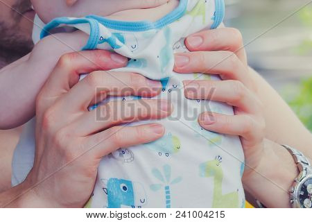 Close-up To Hands  Of Father Embracing And Kissing His Sweet Ado